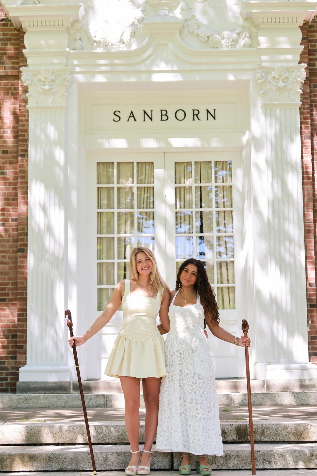 Addison Smith and a friend on the steps of Sanborn House at Dartmouth